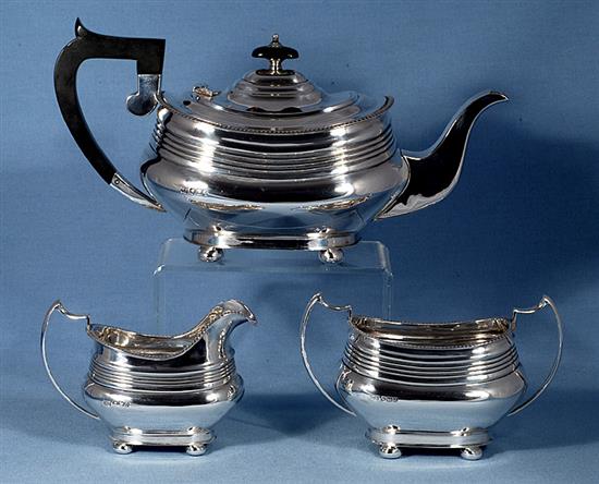 A 1940s silver three piece tea set, by William Bush & Sons, teapot height 156mm, gross weight 41.2oz/1283grms